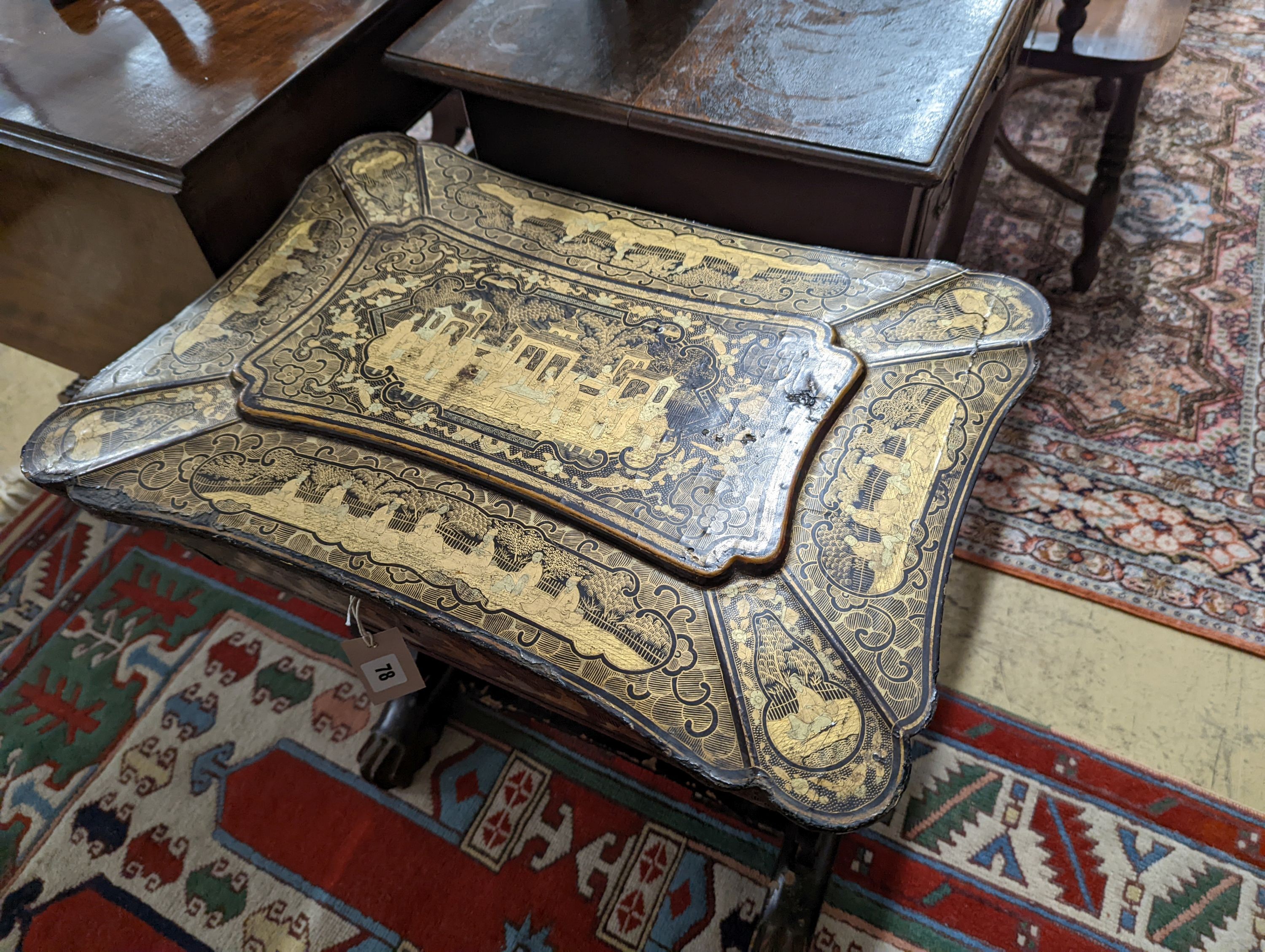 A mid 19th century Chinese export lacquer work table. W-59cm,D-41cm, H-66cm., containing bone accessories